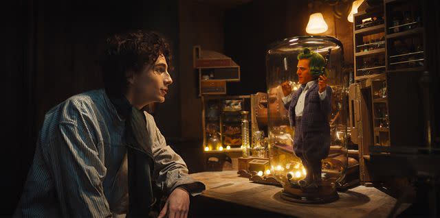 Jaap Buittendijk/Warner Bros. Timothee Chalamet and Hugh Grant in 'Wonka'