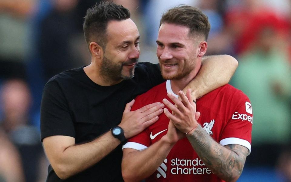 Liverpool's Alexis Mac Allister with Brighton & Hove Albion manager Roberto De Zerbi after the match