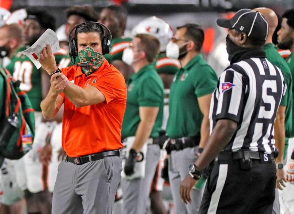 UM’s coach Manny Diaz signals a hold to an official in the first quarter as the University of Miami host Florida State University Seminoles at Hardrock Stadium in Miami Gardens on Saturday, September 26, 2020.