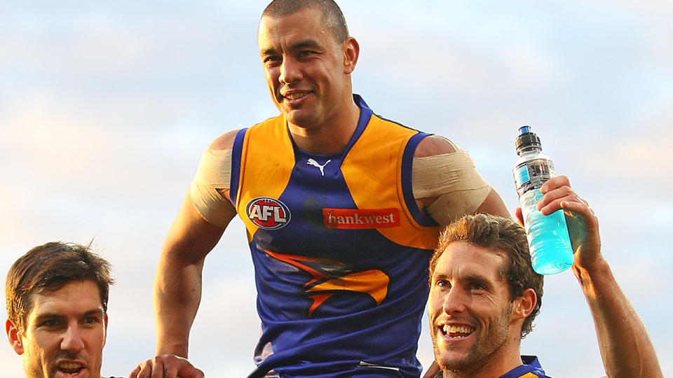 Daniel Kerr, pictured here being carried from the field by his teammates after playing his 200th game in 2012.