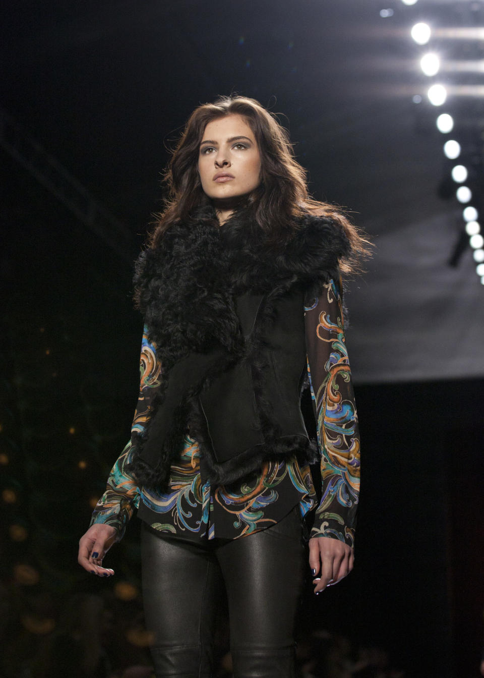 A model walks the runway during the Nicole Miller Fall 2013 fashion show during Fashion Week, Friday, Feb. 8, 2013, in New York. (AP Photo/Karly Domb Sadof)