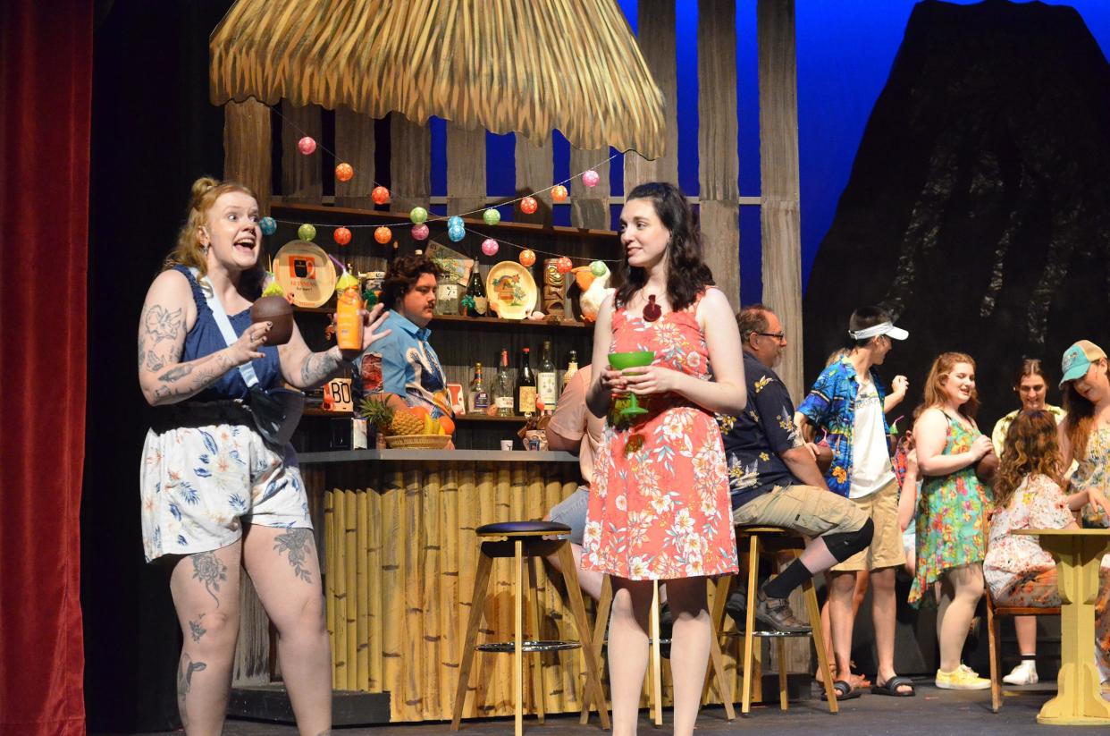 Meg Clark as Tammy and Ally Szymanski as Rachel talk about their whirlwind romances with two employees of the Margaritaville resort in “Escape to Margaritaville” at the Croswell Opera House.