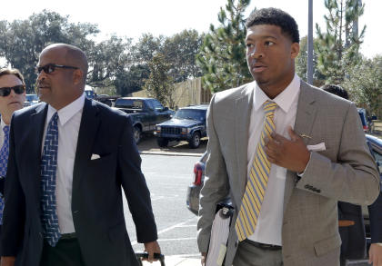 Jameis Winston (R) and his attorney David Cornwell arrive at Winston's conduct hearing Tuesday. (AP)