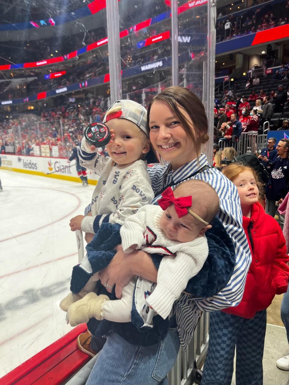 Washington Capitals player Nic Dowd's wife, Paige, and their children.