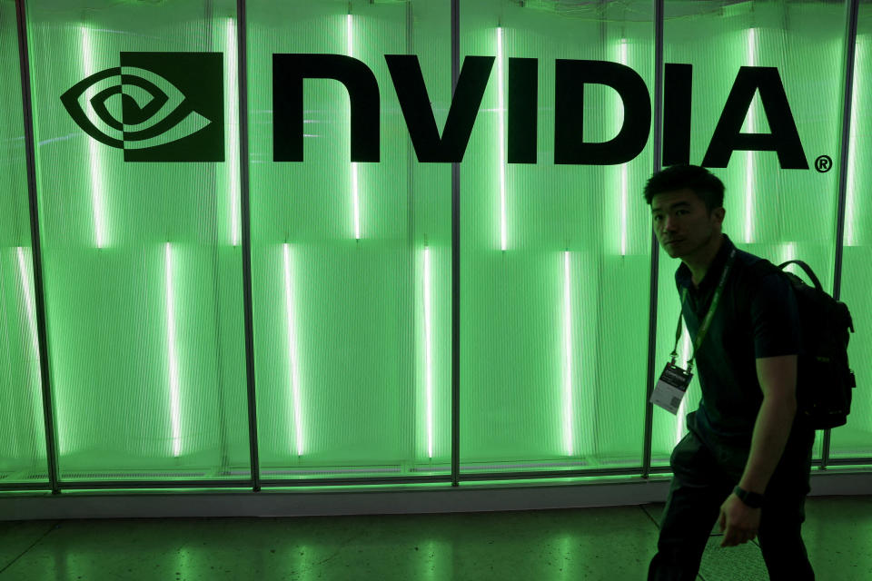 FILE PHOTO: A person walks pass a Nvidia logo at Computex in Taipei, Taiwan June 5, 2024. REUTERS/Ann Wang/File Photo/File Photo