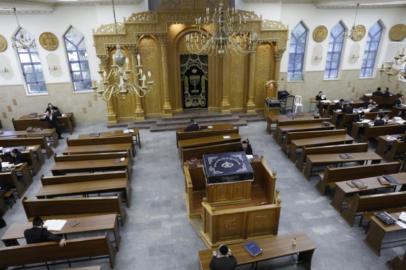 FILE PHOTO: Ultra Orthodox Jewish men study inside a synagogue in the Israeli settlement of Beitar Illit in the occupied West Bank