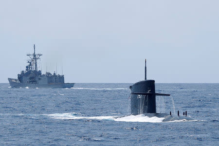 The Hai Lung SS-793 diesel-electric submarine emerges from underwater during a during a drill near Yilan naval base, Taiwan April 13, 2018. REUTERS/Tyrone Siu