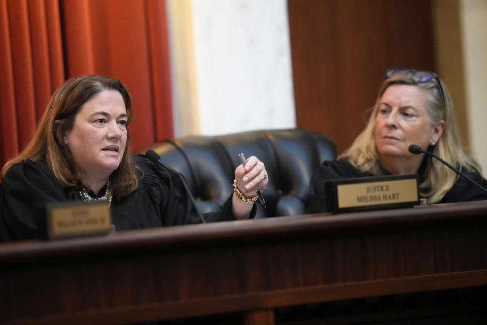 Colorado Supreme Court Justice Melissa Hart and Justice Maria E. Berkenkotter (David Zalubowski / Pool via AP file)
