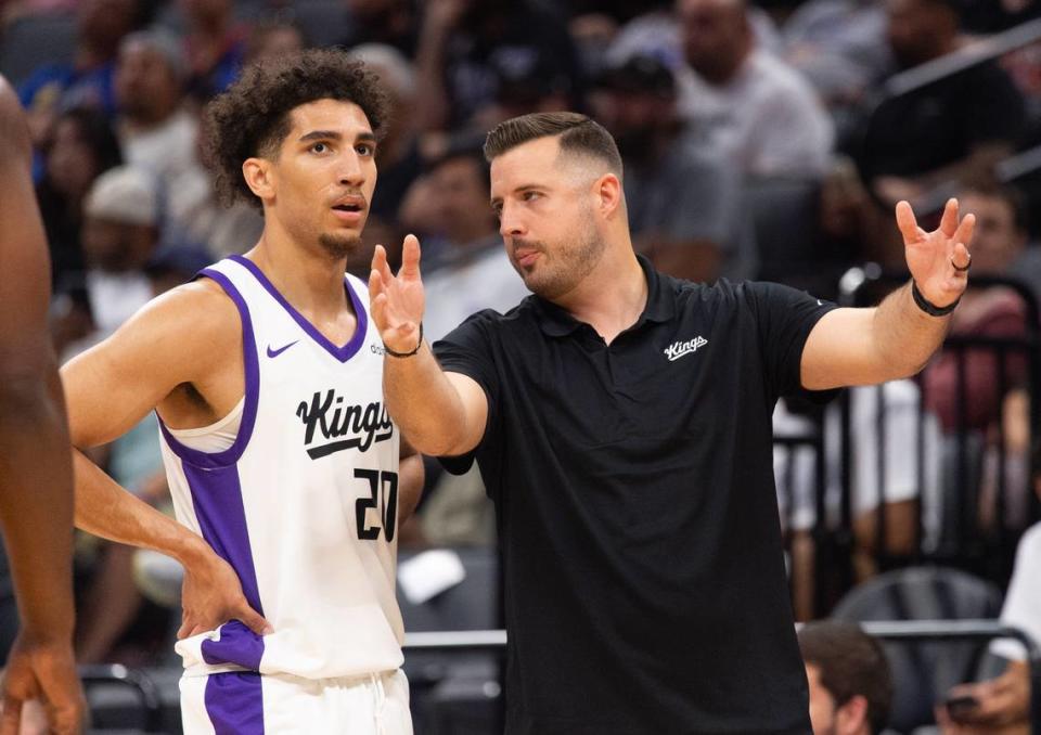 Sacramento Kings coach Luke Loucks talks with Colby Jones during the California Classic Summer League at Golden 1 Center Monday, July 3, 2023 in Sacramento.