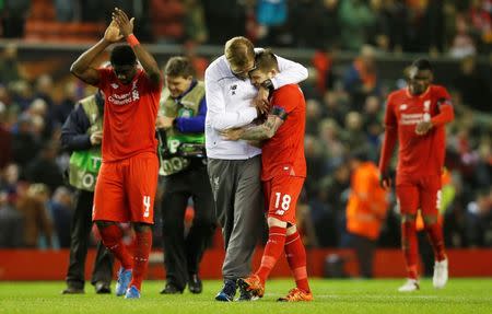 Football Soccer - Liverpool v FC Girondins de Bordeaux - UEFA Europa League Group Stage - Group B - Anfield, Liverpool, England - 26/11/15 Liverpool manager Juergen Klopp and Alberto Moreno celebrate at the end of the match Reuters / Andrew Yates