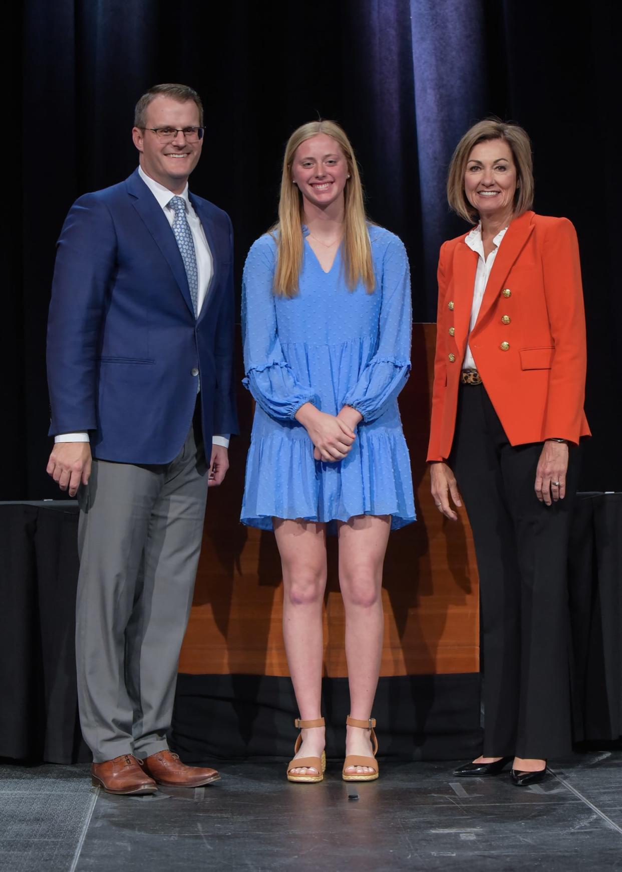 Lydia Olejniczak of Perry High School is recognized by Lt. Gov. Adam Gregg and Gov. Kim Reynolds during the Governor’s Scholar Recognition Ceremony on April 30.