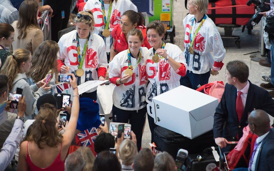 Team GB athletes are welcomed home at Heathrow - EDDIE MULHOLLAND