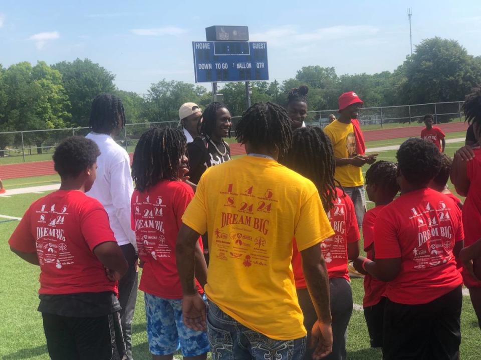 Kansas City Chiefs receivers Rashee Rice, Mecole Hardman, Hollywood Brown and Xavier Worthy talk with children attending Pat Clarke’s “Dream Big” youth football camp on Saturday, June 8, 2024, at Central High School in Kansas City, Missouri.