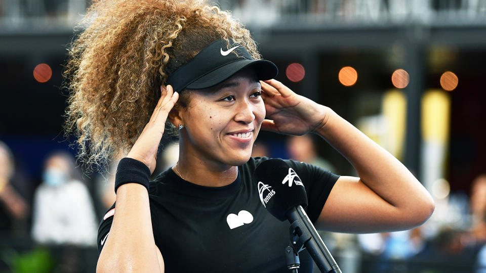 Naomi Osaka (pictured) reacting to the crowd in Australia.