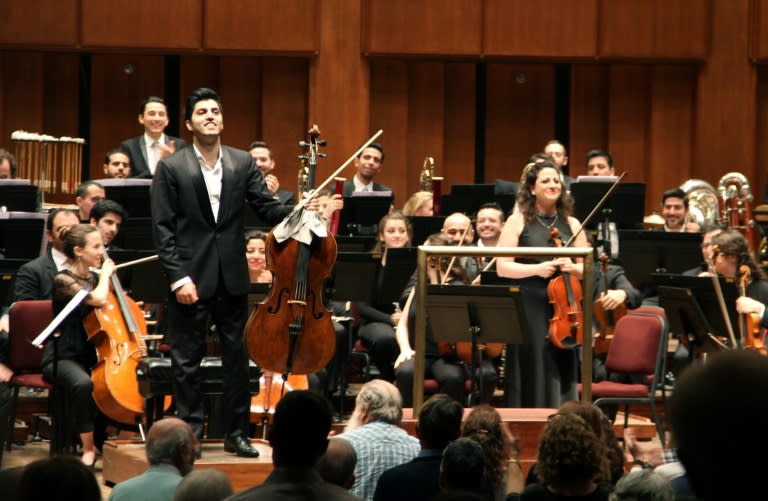 Kian Soltani, left, who plays on a 1680 cello by the Grancino brothers, and violist Miriam Manasherov stand after playing solos in Richard Strauss's "Don Quixote" at the John F Kennedy Center for the Performing Arts in Washington on November 7, 2018