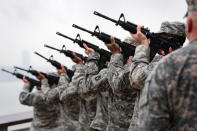 An honor guard fires a 7-gun salute during a ceremony commemorating the 71st anniversary of the Japanese attacks on Pearl Harbor on December 7, 2012 in New York City. World War II veterans from the New York metropolitan area participated in a wreath-laying ceremony next to the Intrepid Sea, Air and Space Museum, which was damaged in Hurricane Sandy and is undergoing repairs. (Photo by John Moore/Getty Images)