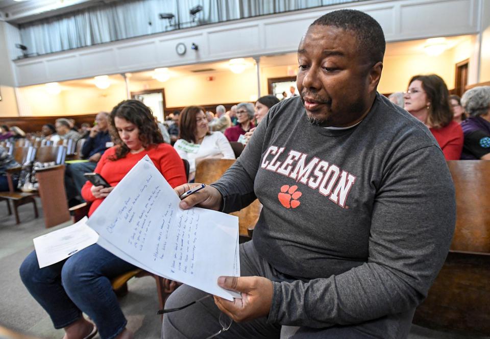 Dr. Ernest Mackins of Anderson looks over what he wants to say during the Anderson County Council in the Historic Courthouse in Downtown Anderson, S.C. Tuesday, March 5, 2024. Mackins and others were present for the third reading of an ordinance, 2024-010, "An Ordinance to amend second 28-48 of the Code of Ordinances, Anderson County, South Carolina, to provide for two at-large members to the Anderson County Library Board of Trustees: and other matters related thereto," with public hearing three minute limit. The ordinance already passed two readings in earlier meetings.