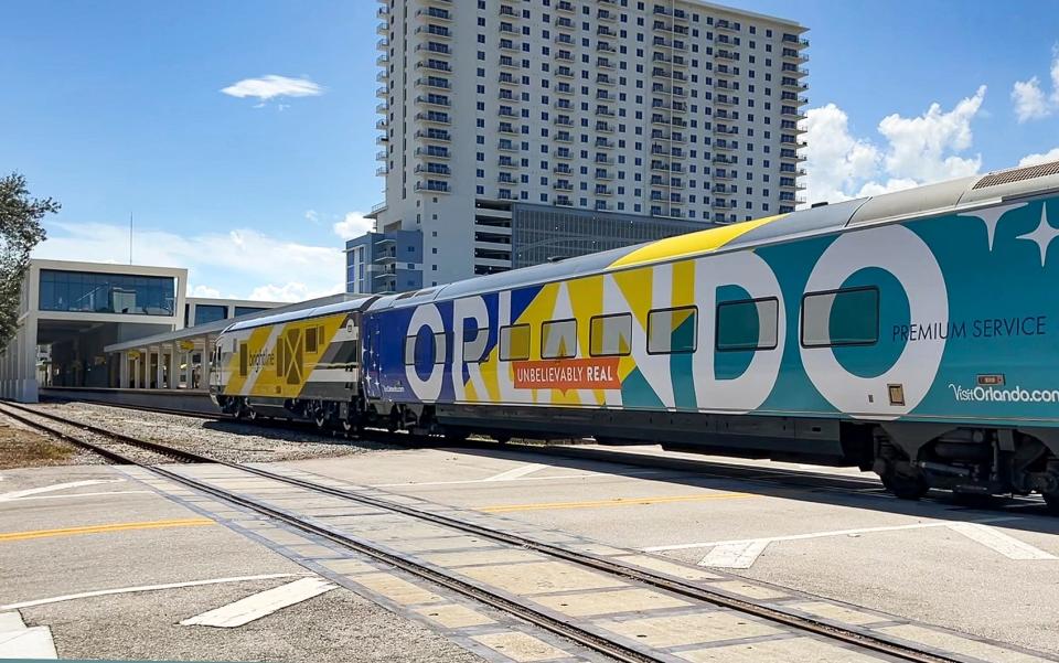 A Brightline trains heads to Orlando from the West Palm Beach station in West Palm Beach, Florida on September 22, 2023.