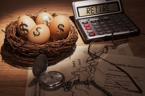 A bird nest with eggs bearing dollar signs, next to a calculator that says retire and a stopwatch.