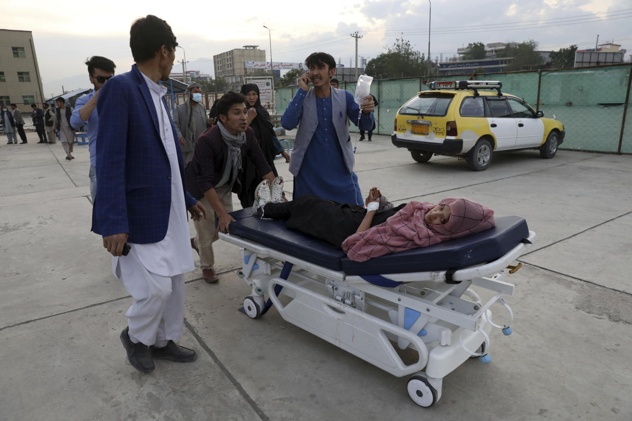 An injured school student is transported to a hospital after a bomb explosion near a school in west of Kabul, Afghanistan, Saturday, May 8, 2021. A bomb exploded near a school in west Kabul on Saturday, killing several people, many them young students, an Afghan government spokesmen said. (AP Photo/Rahmat Gul)