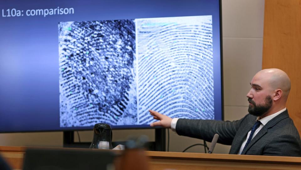 Martin Orlowicz, a New Hampshire State Police Forensic Lab latent print examiner, testifies how he identified fingerprints in the Families in Transition Shelter (AP)