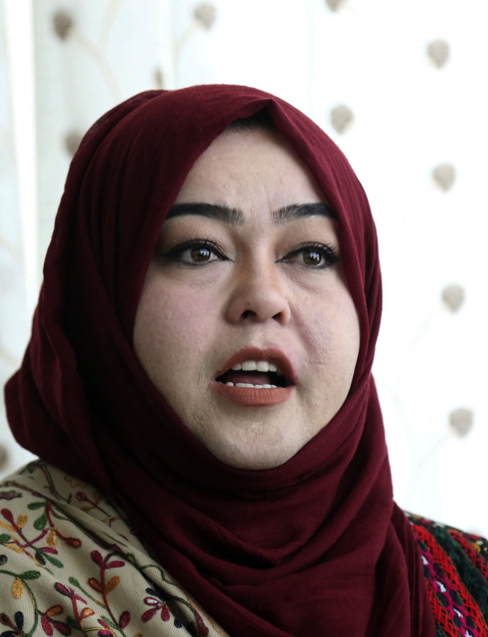 In this Sunday, Oct. 14, 2018 photo, Hameeda Danesh, a candidate for Parliament, hoping to represent the deeply conservative district of Jalrez in central Wardak province, speaks during an interview with The Associated Press, in Kabul, Afghanistan. In Saturday’s election 417, or roughly 16 percent, of the 2,565 candidates competing for seats in the 249-member chamber are women. Yet in rural Afghanistan, especially in the country’s ethnic Pashtun areas where the Taliban dominate, many women are not even registered to vote. (AP Photo/Rahmat Gul)