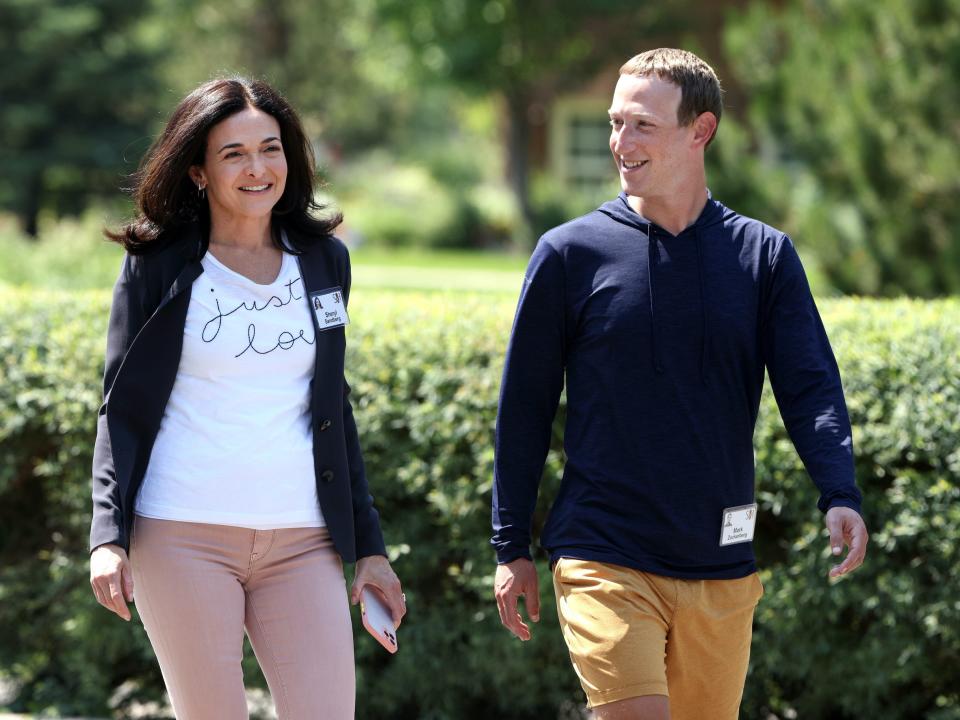 Sheryl Sandberg walks with Mark Zuckerberg at Sun Valley