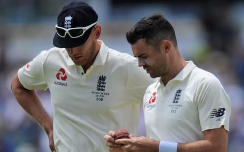 James Anderson speaks with teammate Stuart Broad - Credit: AFP