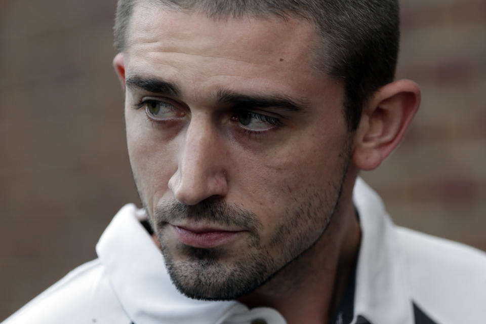 Kenneth W. Smith Jr., walks near the U.S. Courthouse, Friday, Sept. 7, 2012, in Philadelphia. Smith was arrested and is charged with making a hoax threat that led authorities to recall a plane in midair to the Philadelphia airport. Federal authorities charged 26-year-old Smith Jr. with conveying false and misleading information. According to a criminal complaint, Smith called police at the airport on Thursday, Sept. 6, 2012 and falsely reported a passenger was carrying an explosive substance. Authorities then recalled a Dallas-bound US Airways flight to Philadelphia. (AP Photo/Matt Rourke)