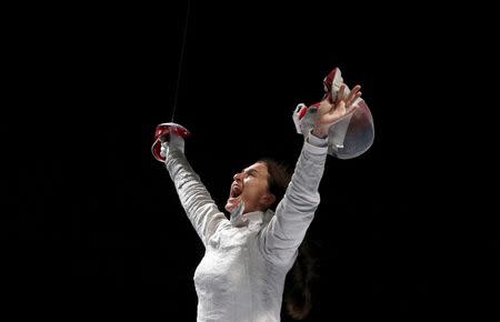 Russia's Sofya Velikaya celebrates the victory over team Ukraine in the women's team sabre final at the World Fencing Championships in Moscow, Russia, July 17, 2015.