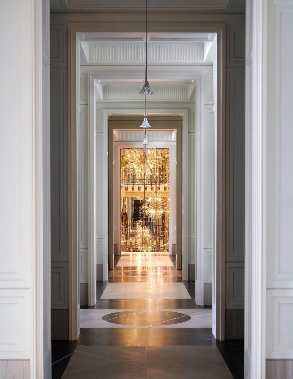 An enfilade features Baccarat lighting.