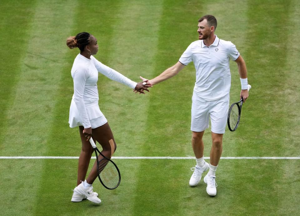 Venus Williams and Jamie Murray celebrate a point (Zac Goodwin/PA) (PA Wire)