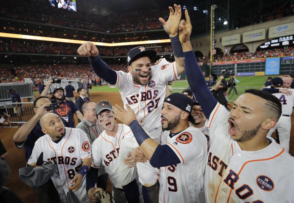 Houston Astros’ Jose Altuve is lifted by teammates after Game 7 of baseball’s American League Championship Series against the New York Yankees Saturday, Oct. 21, 2017, in Houston. The Astros won 4-0 to win the series. (AP Photo/David J. Phillip)