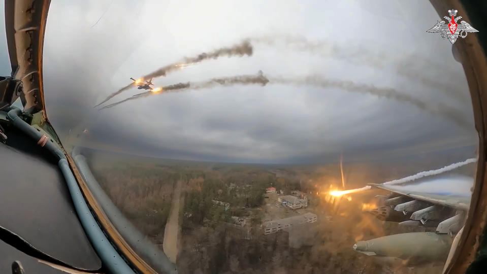 FILE - In this photo taken from video released by the Russian Defense Ministry Press Service on Monday, Jan. 22, 2024, a Su-25 warplane is seen from the cockpit of another such aircraft as they fire rockets on a mission over Ukraine. As the Kremlin watches for more signs of crumbling Western support for Ukraine, the Russian military has pressed attacks in several sectors in a bid to drain Kyiv's reserves and deplete its munitions. (Russian Defense Ministry Press Service via AP, File)