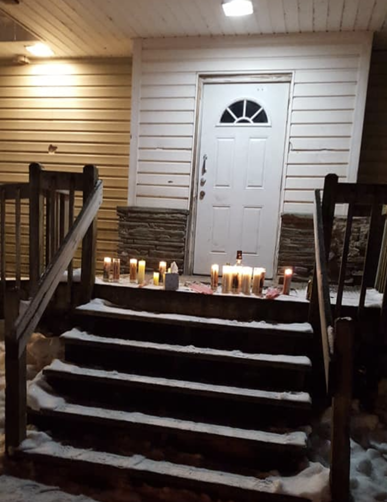 Candles lit on a doorstep in memory of Chris Pekny. Source: Facebook