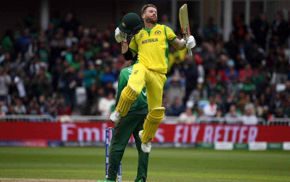 Australia's David Warner celebrates his century during the 2019 Cricket World Cup group stage match between Australia and Bangladesh at Trent Bridge - Paul ELLIS/AFP