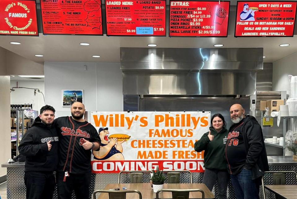 Wilson Tadros, far right, with his children inside a Willy’s Phillys restaurant. The family in March 2023 opened its third location, near Herndon Avenue near Highway 99 in Fresno.