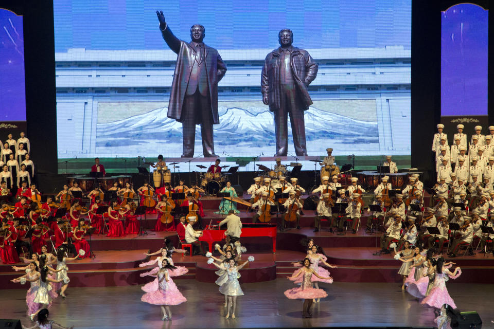 A large screen displays statues of late North Korean leaders Kim Il Sung and Kim Jong Il during a evening gala performance on the eve of the 70th anniversary of North Korea's founding day in Pyongyang, North Korea, Saturday, Sept. 8, 2018. North Korea will be staging a major military parade, huge rallies and reviving its iconic mass games on Sunday to mark its 70th anniversary as a nation. (AP Photo/Ng Han Guan)