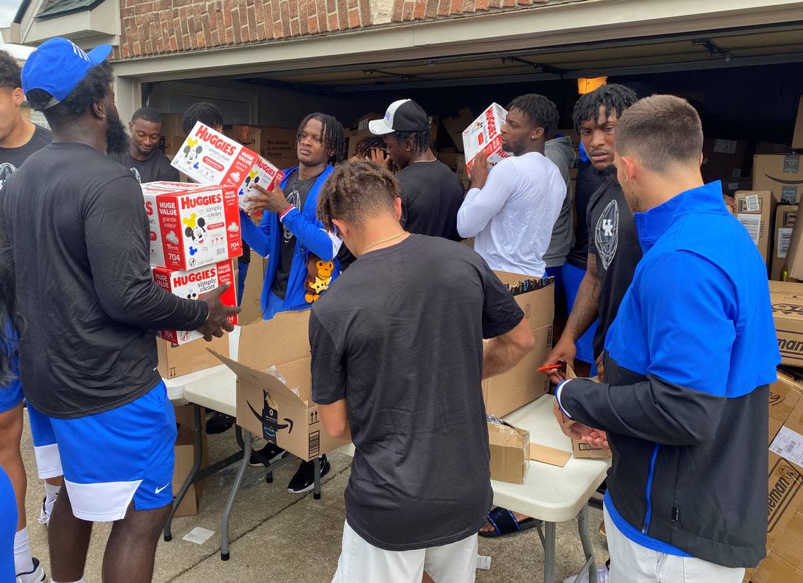 Kentucky football players helped pack boxes of supplies to be sent to Eastern Kentucky to support flood relief efforts.