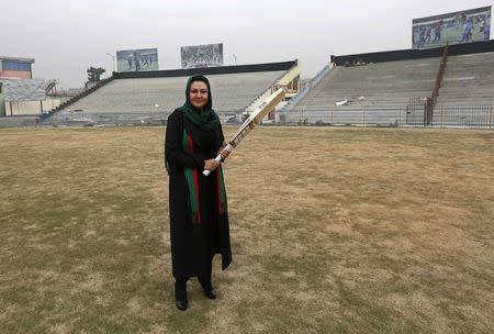 The founder of the national women's team, Afghan Diana Barakzai, poses for a picture at the Kabul Cricket Stadium December 24, 2014. REUTERS/Mohammad Ismail