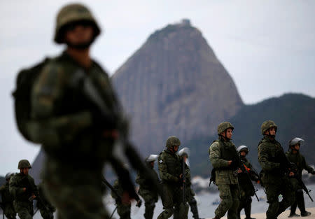 Brazilian Navy soldiers attend an exercise on Flamengo beach ahead of the 2016 Rio Olympics in Rio de Janeiro, Brazil. REUTERS/Ueslei Marcelino
