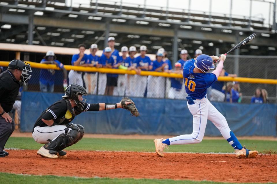 Martin County's Nick Robert (10) swings at a pitch against Jensen Beach in a high school baseball game Thursday, April 14, 2022, at Martin County High School in Stuart. Jensen Beach won 2-0. 