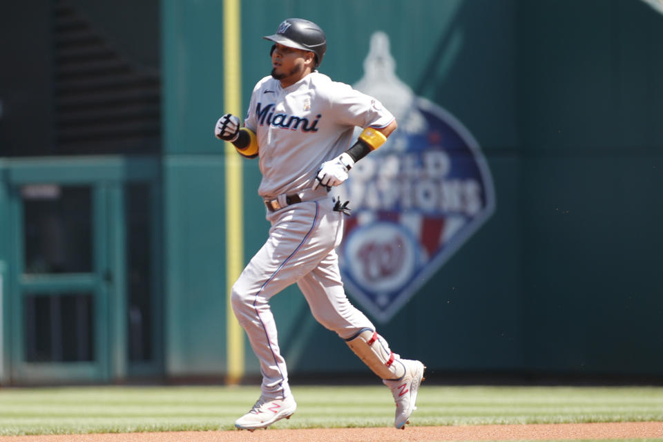 Miami Marlins' Luis Arraez rounds the bases after hitting a solo home run during the first inning of a baseball game against the Washington Nationals, Sunday, Sept. 3, 2023, in Washington. (AP Photo/Luis M. Alvarez)