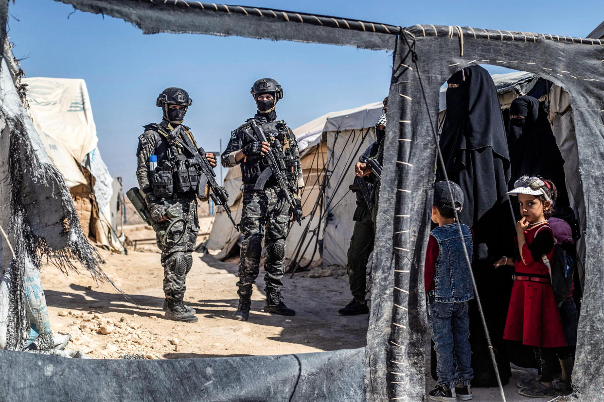 Members of the Syrian Kurdish Asayish security forces inspect tents at the Kurdish-run al-Hol camp, on Aug. 28, 2022, during a security campaign by the Syrian Democratic Forces against IS 