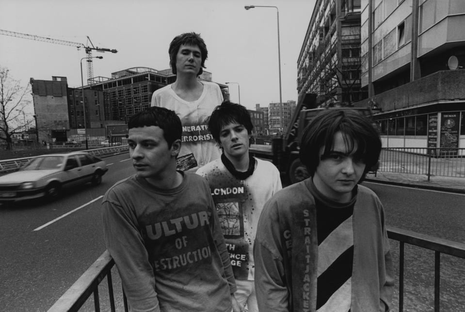 Group portrait of the Manic Street Preachers, Elephant & Castle roundabout, London, 1990. L-R James Dean Bradfield, Nicky Wire, Richey Edwards and Sean Moore. (Photo by Martyn Goodacre/Getty Images)