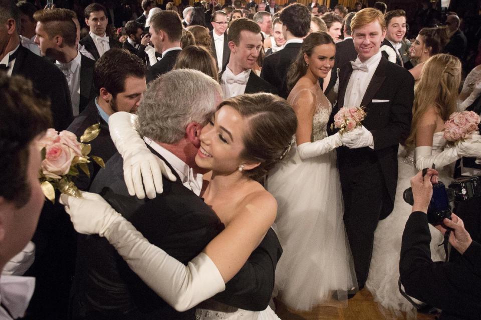 In this Thursday, Dec. 29, 2016 photo, Brindley Mize, of Houston, dances with her father, Christopher Mize, at the International Debutante Ball in New York. (AP Photo/Mark Lennihan)