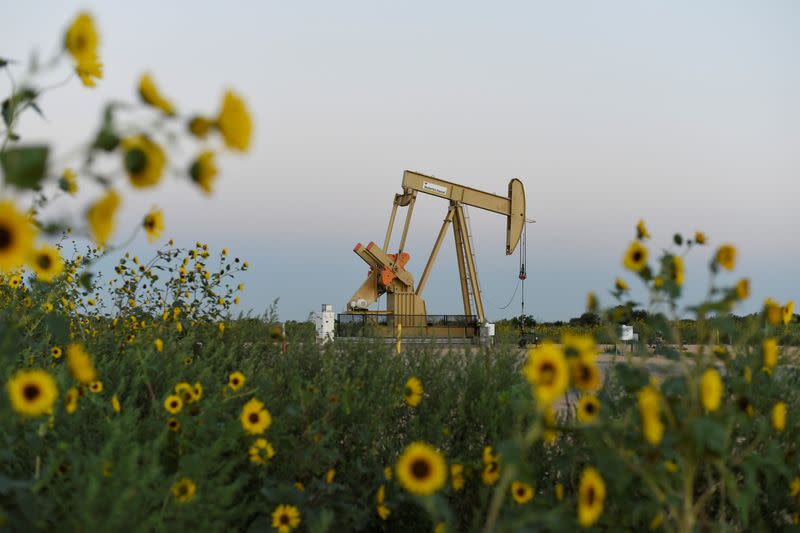 FILE PHOTO: A pump jack operates at a well site leased by Devon Energy Production Company near Guthrie, Oklahoma