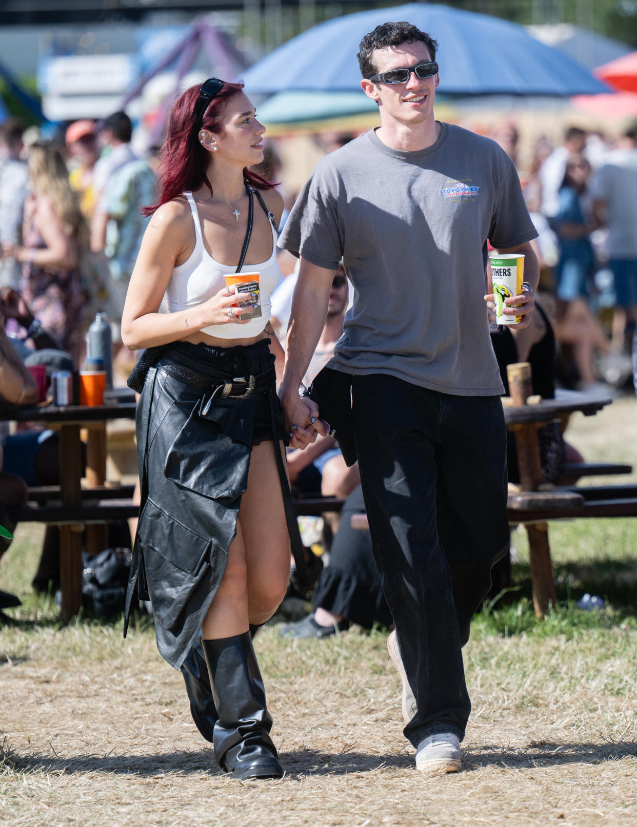 GLASTONBURY, ENGLAND - JUNE 29: Dua Lipa and Callum Turner during day four of Glastonbury Festival 2024 at Worthy Farm, Pilton on June 29, 2024 in Glastonbury, England. Founded by Michael Eavis in 1970, Glastonbury Festival features around 3,000 performances across over 80 stages. Renowned for its vibrant atmosphere and iconic Pyramid Stage, the festival offers a diverse lineup of music and arts, embodying a spirit of community, creativity, and environmental consciousness. (Photo by Samir Hussein/WireImage)