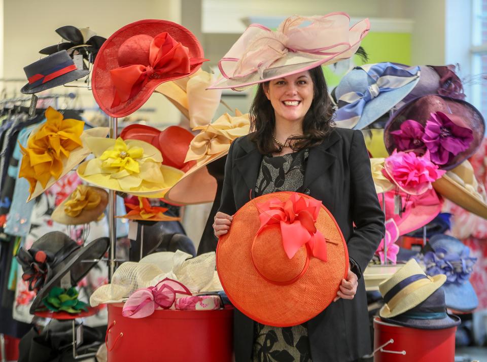 Milliner Christine Moore poses with a display of her hats at Rodes, Friday, Mar 6, 2020.