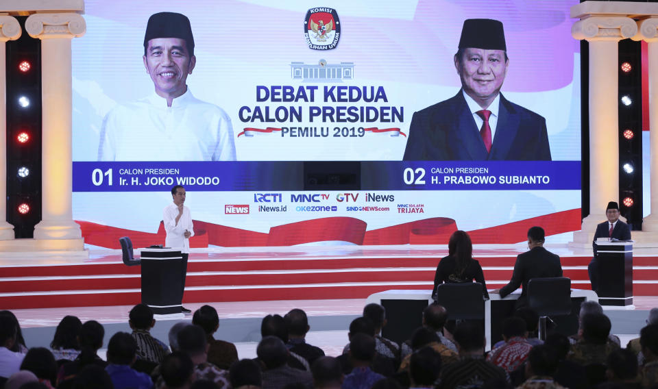 Indonesian presidential candidate Joko Widodo, left, deliver his speech and his contender Prabowo Subianto, right, listen during a televised debate in Jakarta, Indonesia, Sunday, Feb. 17, 2019. Indonesia is gearing up to hold its presidential election on April 17 that will pit in the incumbent against the former general. (AP Photo / Achmad Ibrahim)